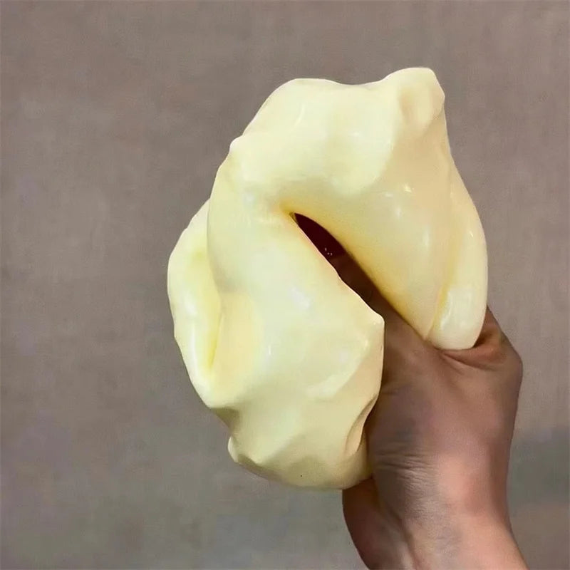 Jumbo cheese cube fidget toy displayed at an angle to show shape.