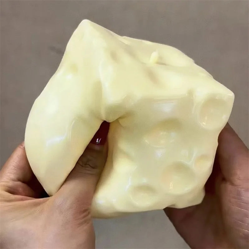 Jumbo cheese cube stress toy displayed alone on a plain background.