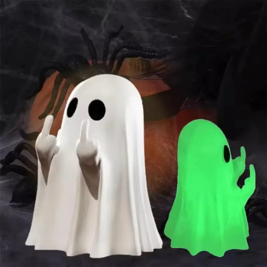 Small ghost resin statue giving a middle finger on a shelf